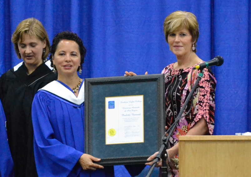 Photo by Carl BR Johnson -- Paulette Flamond accepts her honourary Associate of Arts Degree from Karen Simpson, Northern Lights College board of governors chair.
