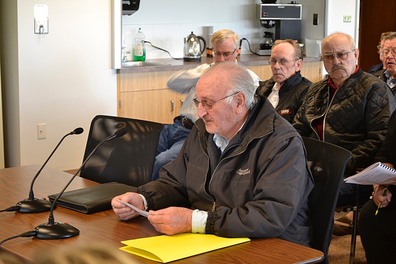 Photo by Carl BR Johnson -- Charles Lasser reads to the PRRD board his statement concerning Bylaw No. 1996, 2011, with which he is strongly opposed, with supporters of Lasser's efforts looking on.