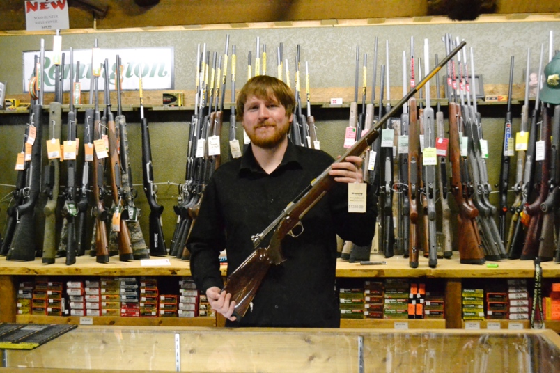 Photo by Carl BR Johnson -- Steve Cole, salesman at Corlane Sporting Goods, hopes that everyone will take advantage of Gun Amnesty Month.